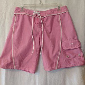Pink board shorts with white trim